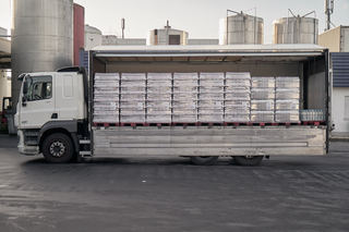 bottled water loaded on truck in factory.